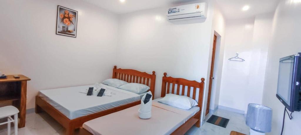 Postel nebo postele na pokoji v ubytování Elnora Delmar Travellers Inn
