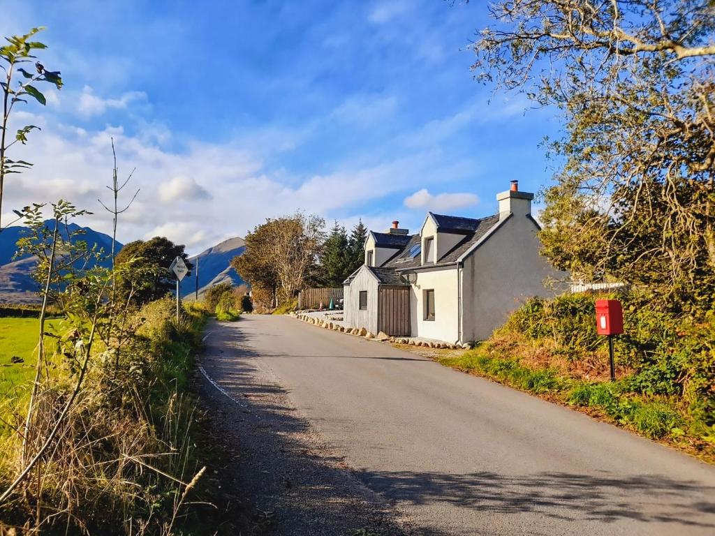 a house on the side of a road at Cuillin View in Torrin