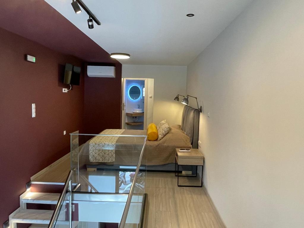 Televízia a/alebo spoločenská miestnosť v ubytovaní SeaSide Loft Kavala