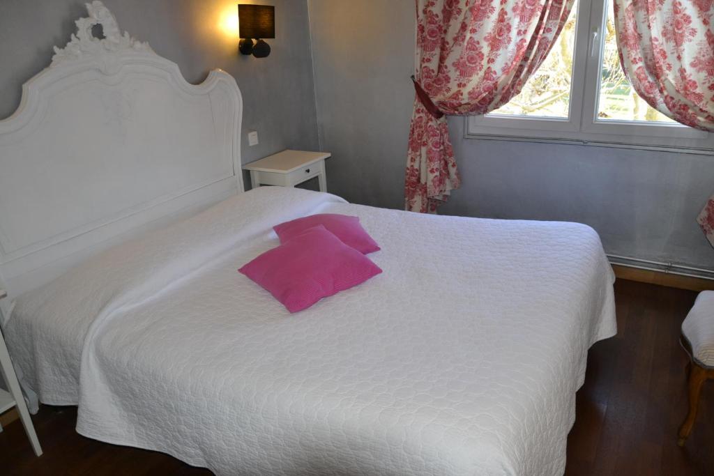Postel nebo postele na pokoji v ubytování Hotellerie de l'Esplanade
