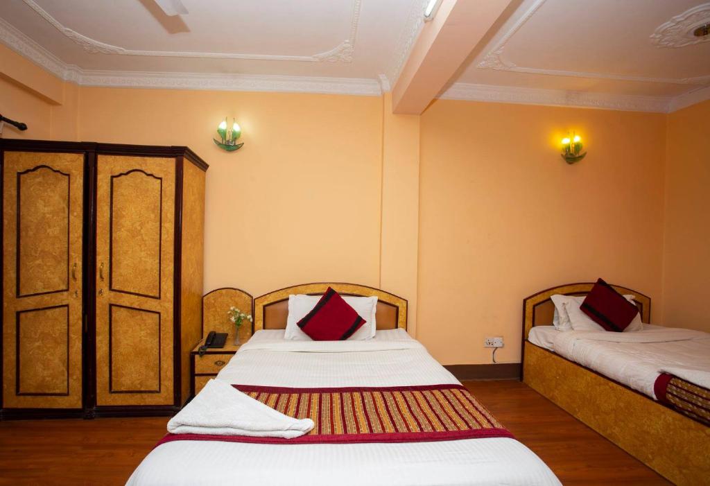 Postel nebo postele na pokoji v ubytování Hotel Mudkhu Durbar