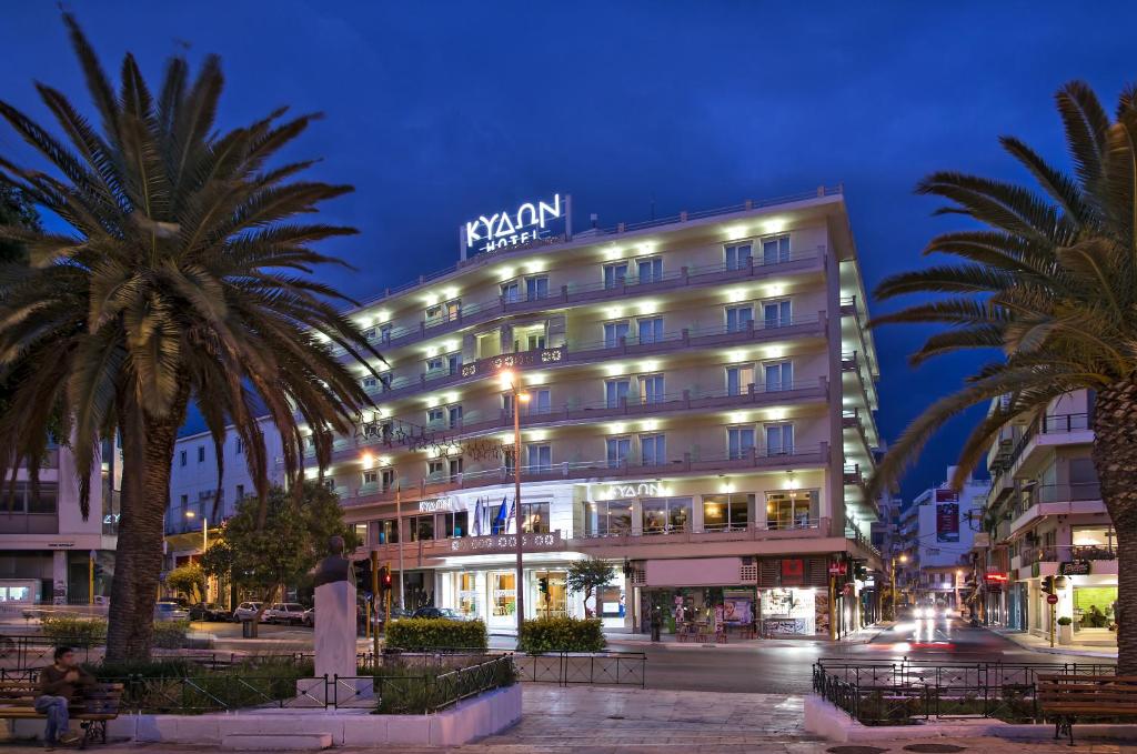 a large building with a large clock on it at Kydon The Heart City Hotel in Chania