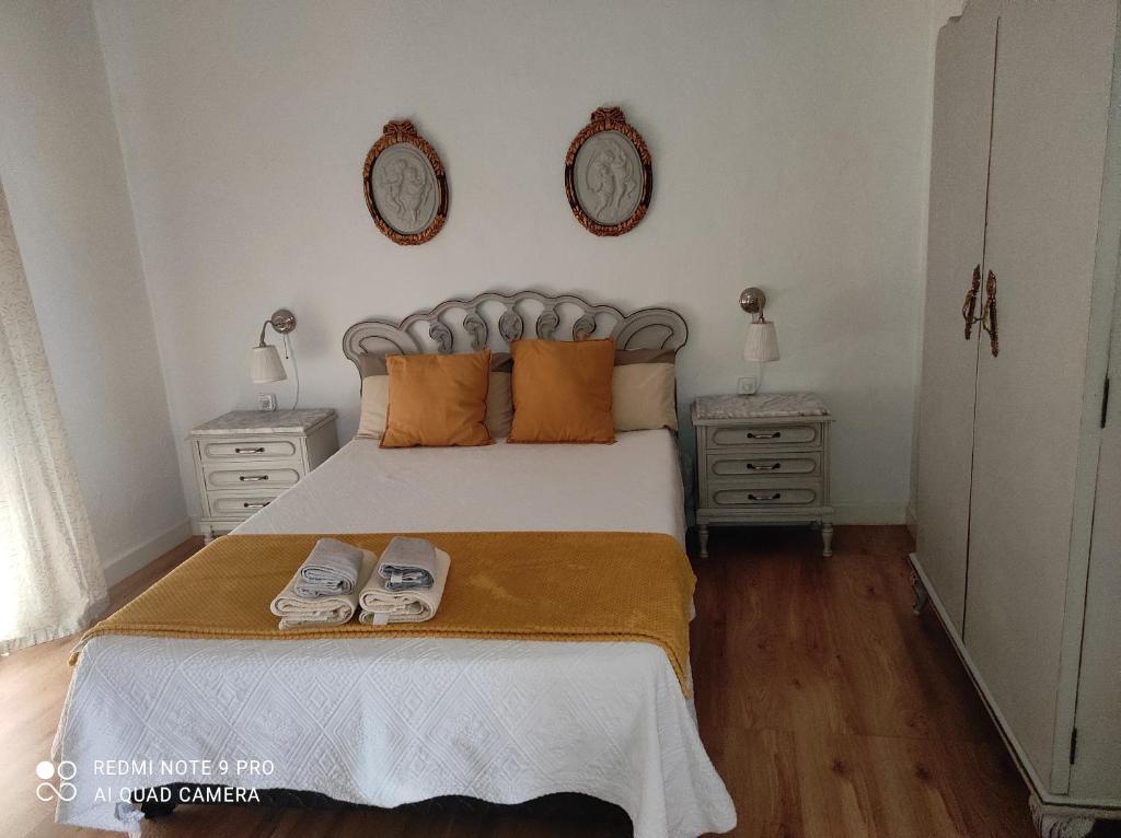 Postel nebo postele na pokoji v ubytování Casa de las Lanzas