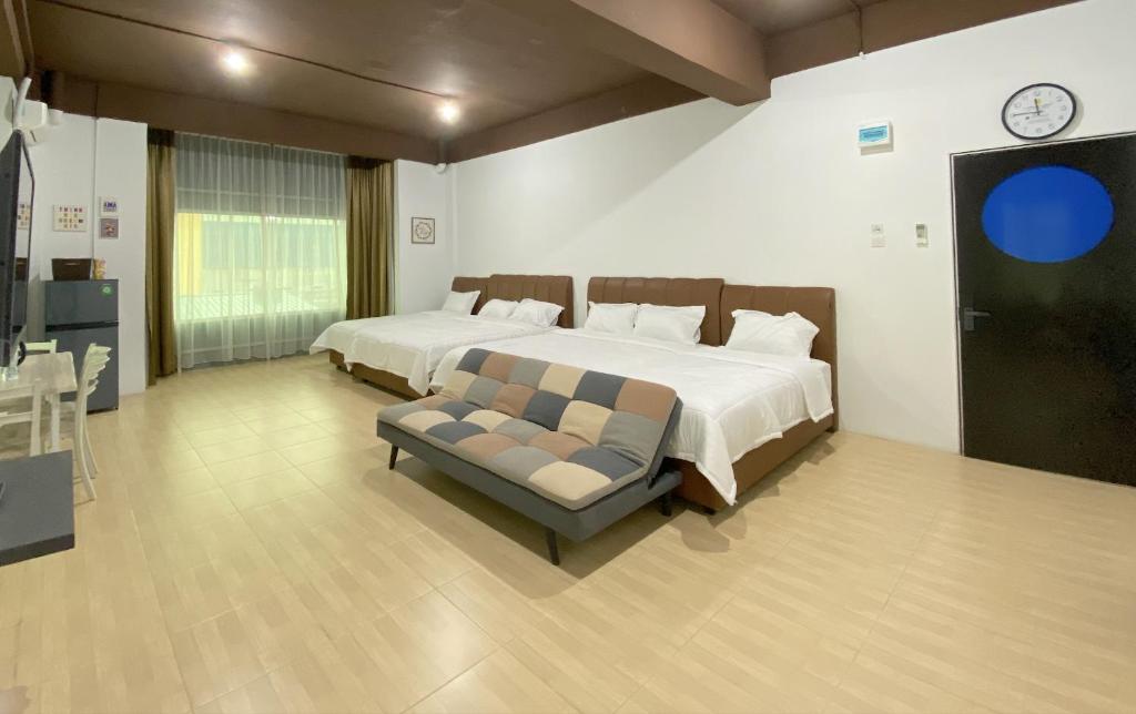 a large bedroom with a bed and a couch at CN Homestay C3 Floor 3 at Nagoya Hill Mall in Nagoya