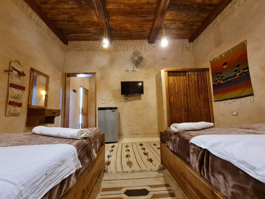 Postel nebo postele na pokoji v ubytování Qasr El salam