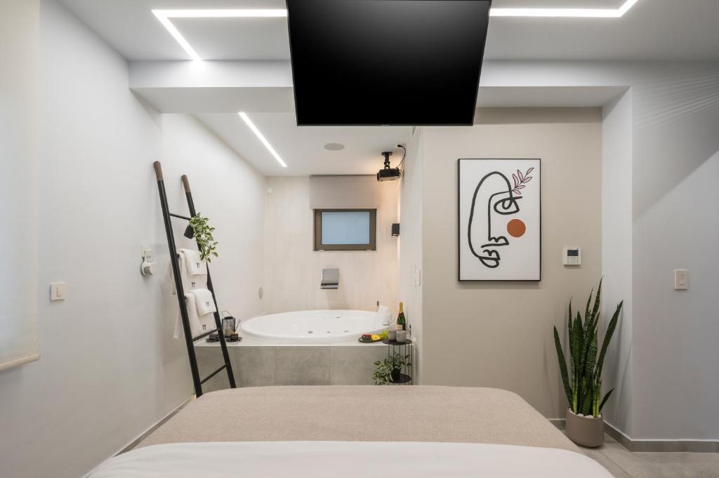 TV a/nebo společenská místnost v ubytování Π Suite Project: Smart BnB