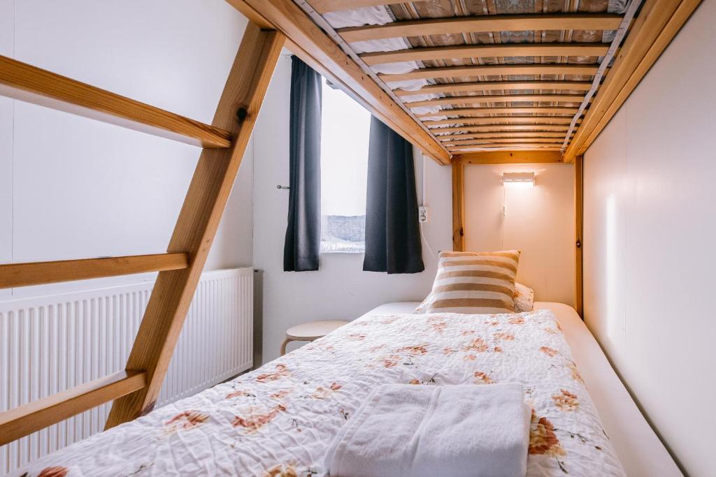 Postel nebo postele na pokoji v ubytování Hlid Hostel