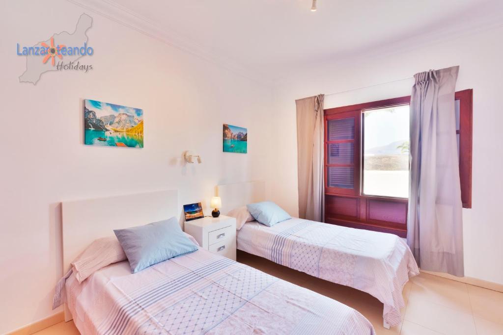 Postel nebo postele na pokoji v ubytování Vivienda Vacacional Casa Ciara