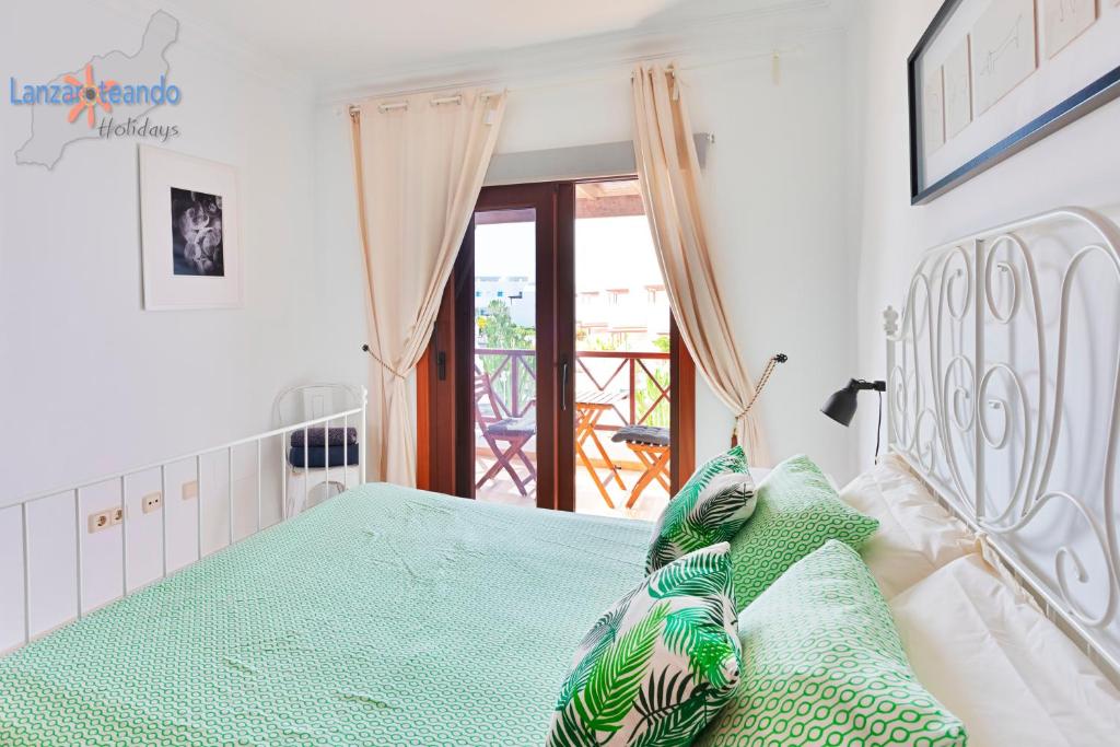 Postel nebo postele na pokoji v ubytování Vivienda Vacacional Casa Ciara