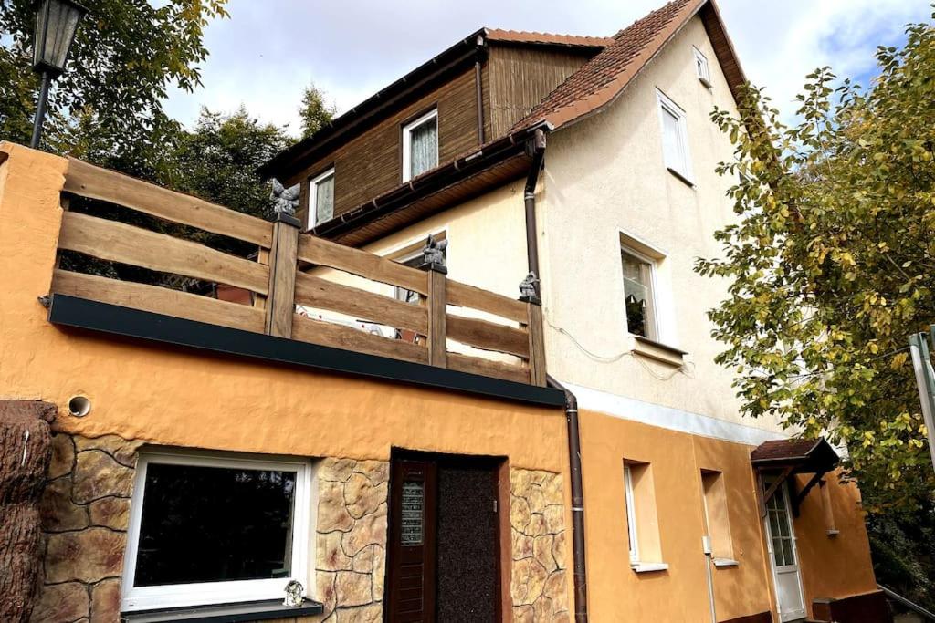 a building with a fence on top of it at im Haus zur Auszeit willkommen in Ruhla