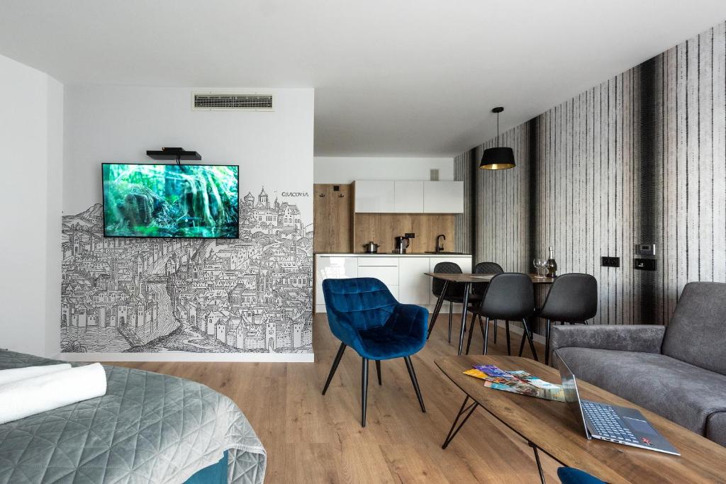 Televízia a/alebo spoločenská miestnosť v ubytovaní InPoint Apartments G11 near Old Town & Kazimierz District & Parking Option