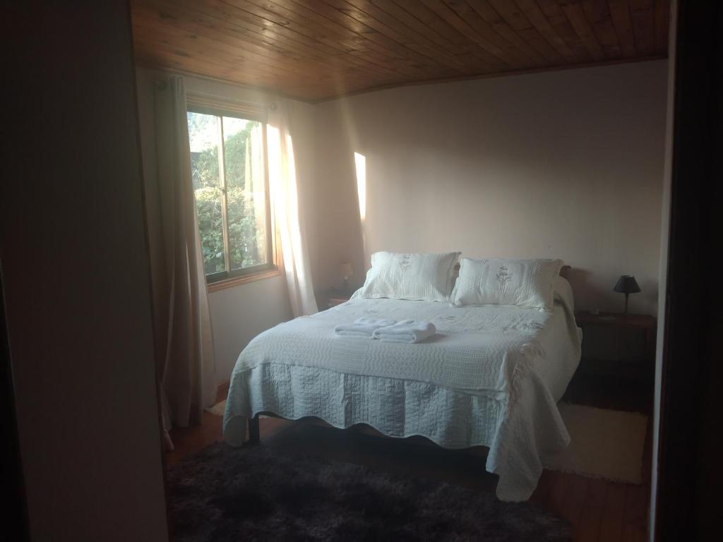 Postel nebo postele na pokoji v ubytování Cabaña acojedora