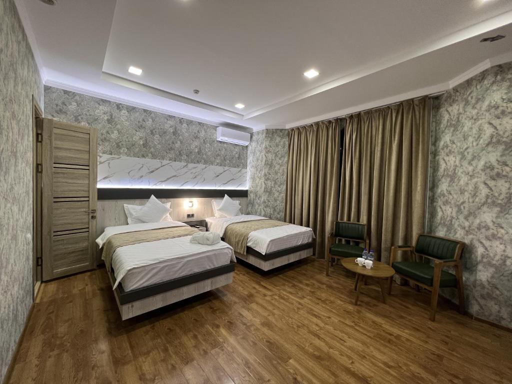 Postel nebo postele na pokoji v ubytování Ada Hotel