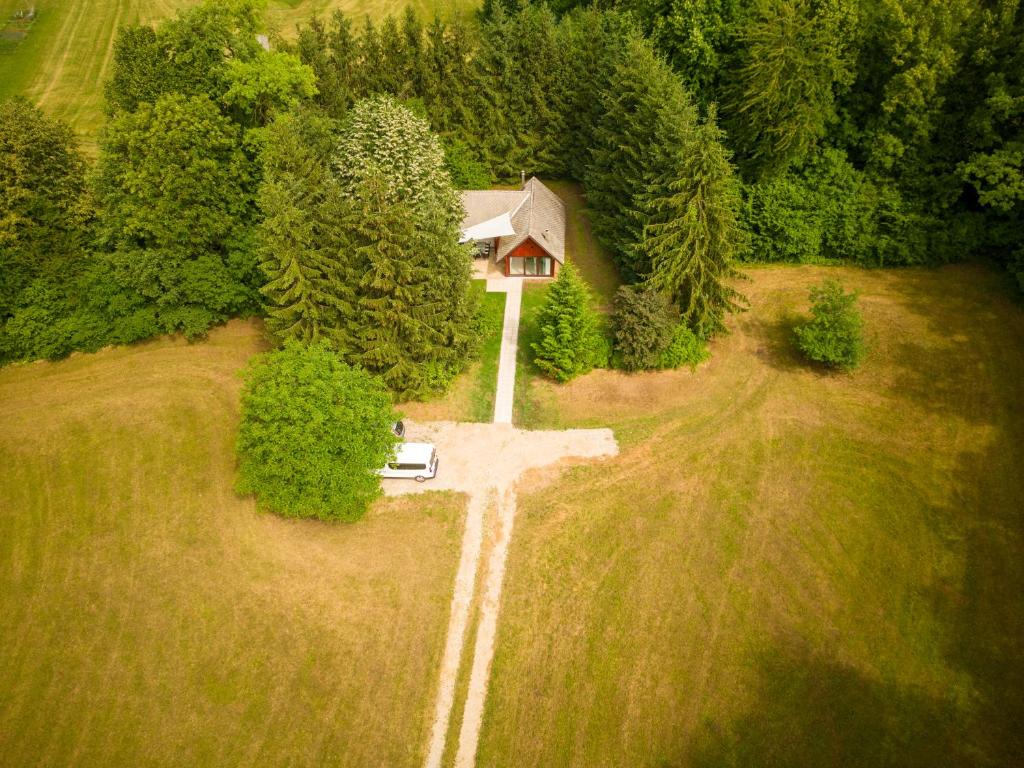 an aerial view of a house in the middle of a field at Čebelnk: sanjska hišica 4 km od Bleda in Lesce