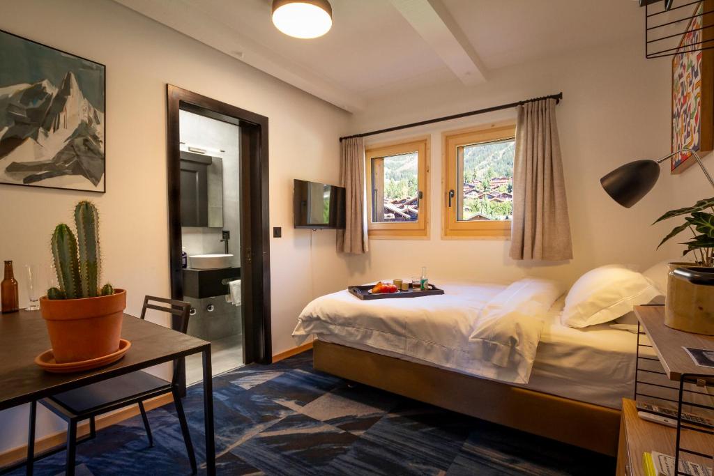 Postel nebo postele na pokoji v ubytování Shed HOTEL