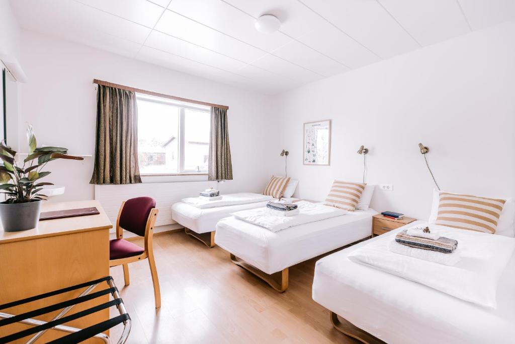 Postel nebo postele na pokoji v ubytování Eldá Guesthouse