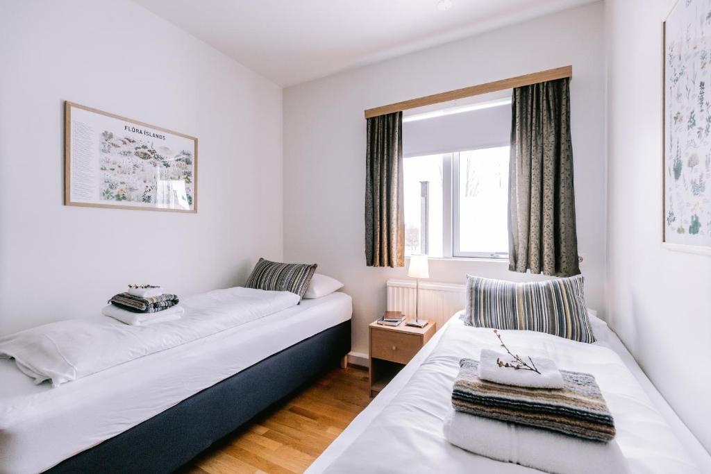 Postel nebo postele na pokoji v ubytování Eldá Guesthouse