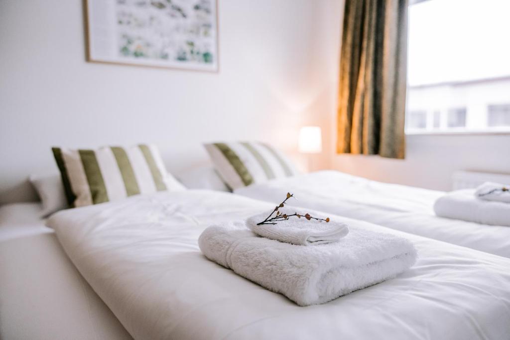 Postel nebo postele na pokoji v ubytování Eldá Guesthouse