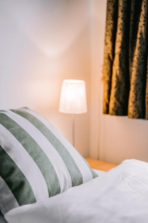 Postel nebo postele na pokoji v ubytování Eldá Guesthouse