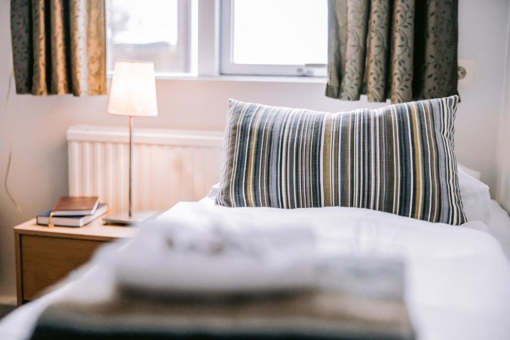 Postel nebo postele na pokoji v ubytování Eldá Guesthouse