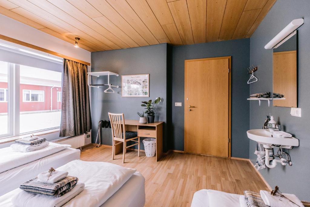 Postel nebo postele na pokoji v ubytování Eldá Guesthouse