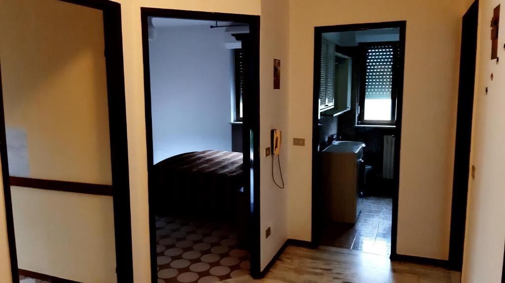 an open door to a bedroom with a bed at Casa Vacanze in Agliè