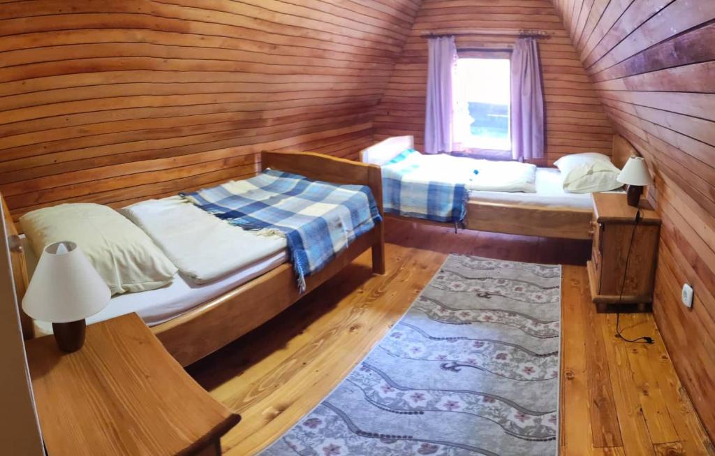 Postel nebo postele na pokoji v ubytování VIKEND KUCA SNJESKO