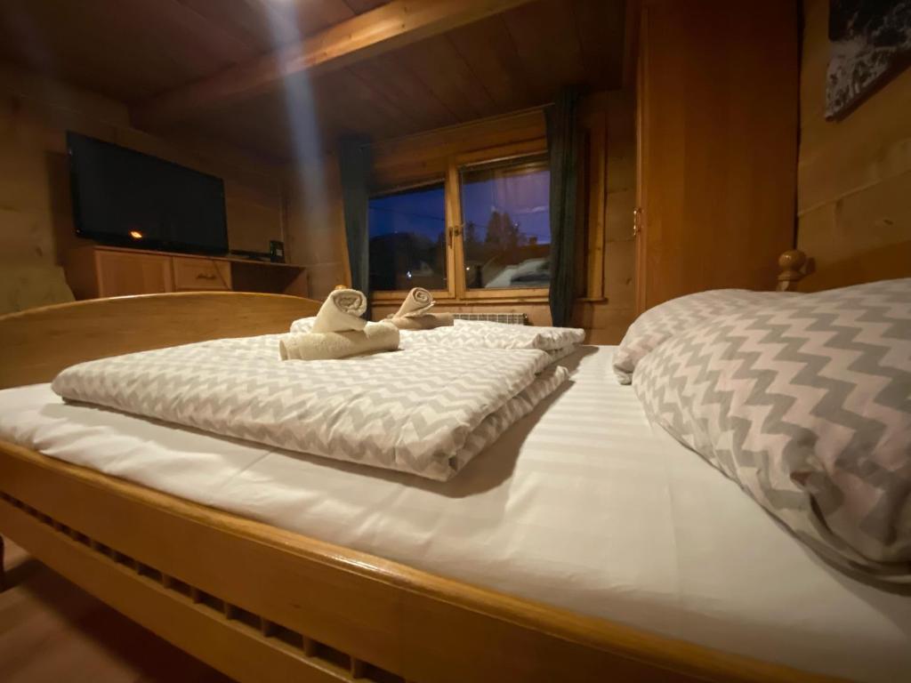 Hostel Regionalny tesisinde bir odada yatak veya yataklar