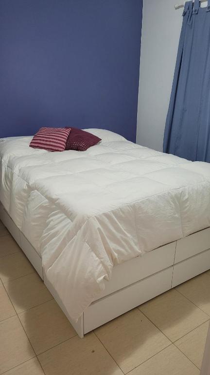 Кровать или кровати в номере Hospedaje Janet