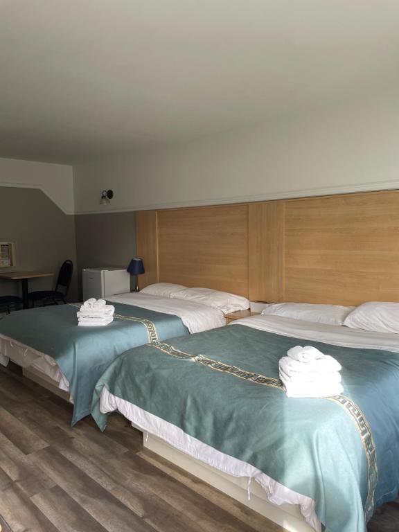 Postel nebo postele na pokoji v ubytování Motel au P'tit Sapin