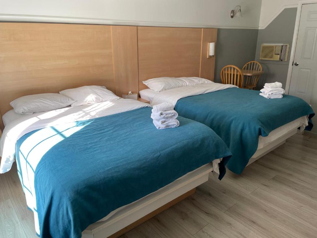 Postel nebo postele na pokoji v ubytování Motel au P'tit Sapin