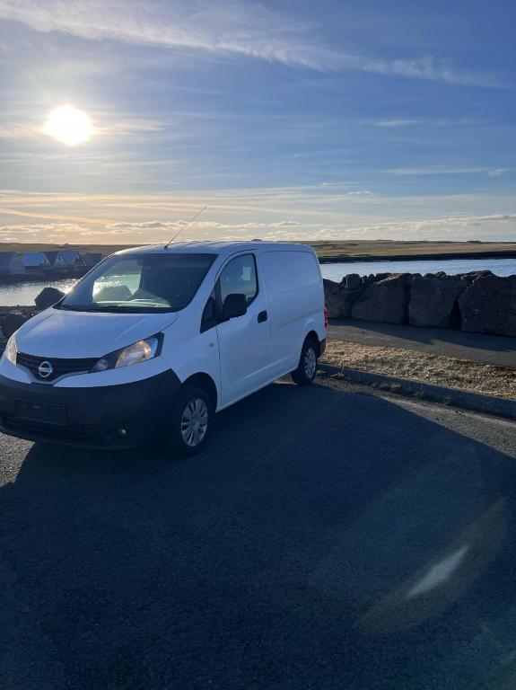 a white van parked on the side of a road at Cheap Camper Van in Iceland in Reykjavík