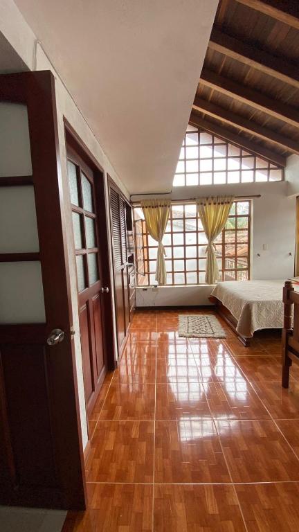 Postel nebo postele na pokoji v ubytování Chez Alicia Hostal