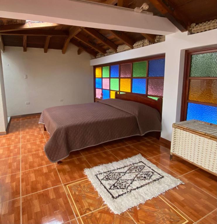 Postel nebo postele na pokoji v ubytování Chez Alicia Hostal