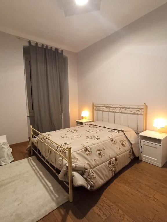 Postel nebo postele na pokoji v ubytování Paradise Rooms - Brignole Station