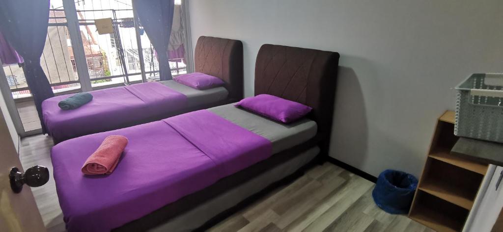 Postel nebo postele na pokoji v ubytování Zero Gravity Homestay 零重力民宿