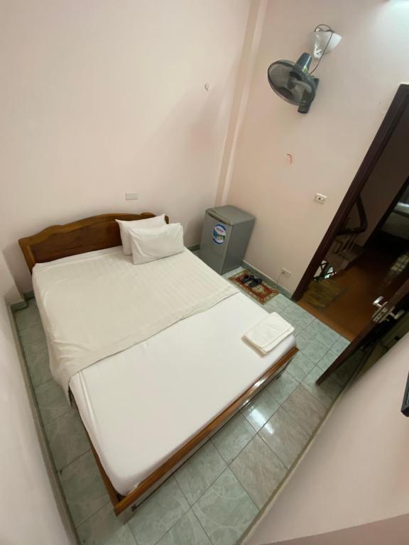 Postel nebo postele na pokoji v ubytování Hoàng Kiên Hotel