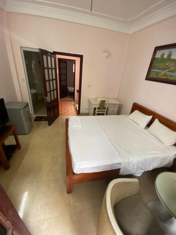 Postel nebo postele na pokoji v ubytování Hoàng Kiên Hotel