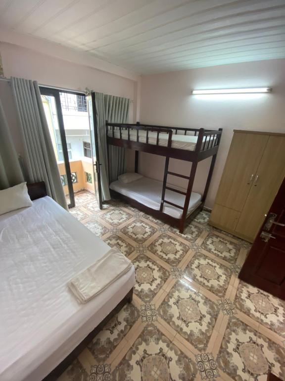Postel nebo postele na pokoji v ubytování Hoàng Kiên Hotel