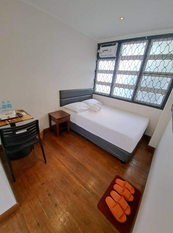 Postel nebo postele na pokoji v ubytování The Hub District Garden Suites