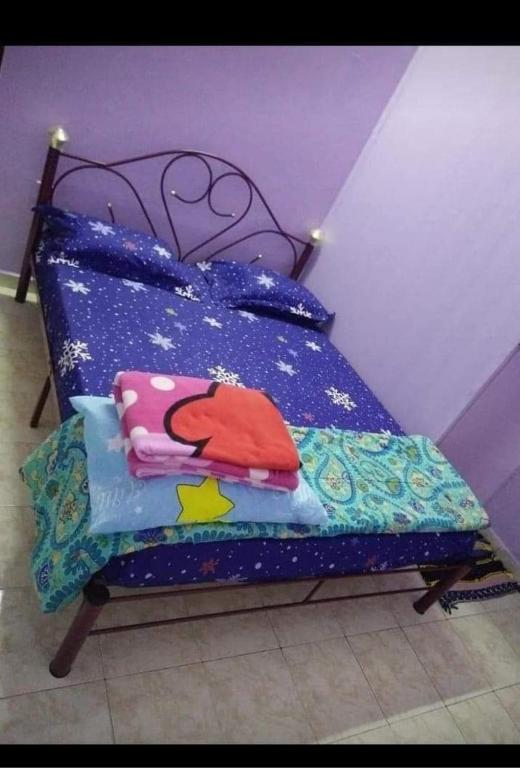 Ένα ή περισσότερα κρεβάτια σε δωμάτιο στο G4 Flats Family Homestay