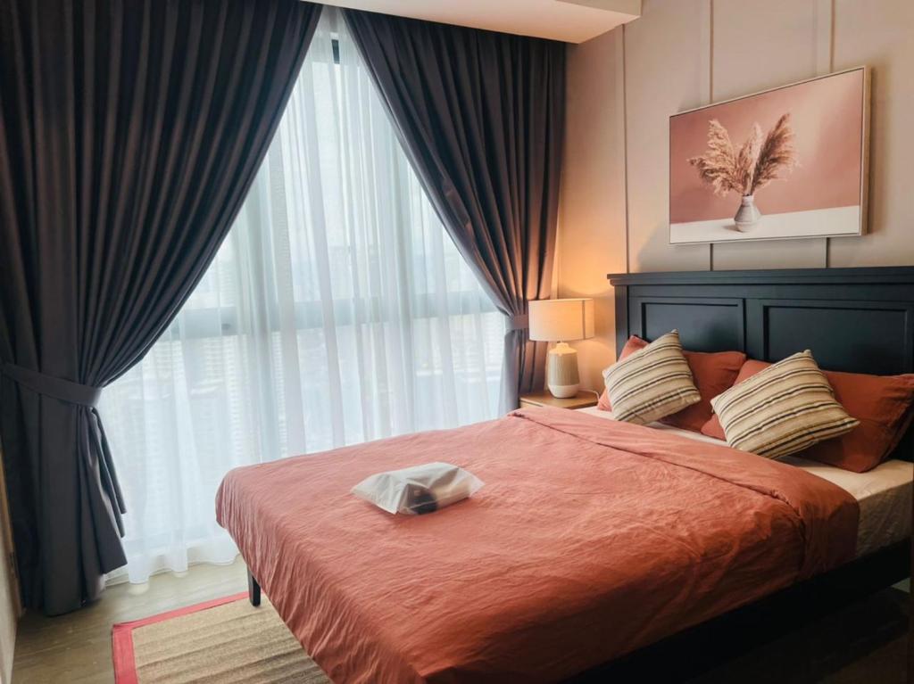 a bedroom with a bed with a large window at Mont Kiara 163 Mall (The Ooak) Private Room in Kuala Lumpur