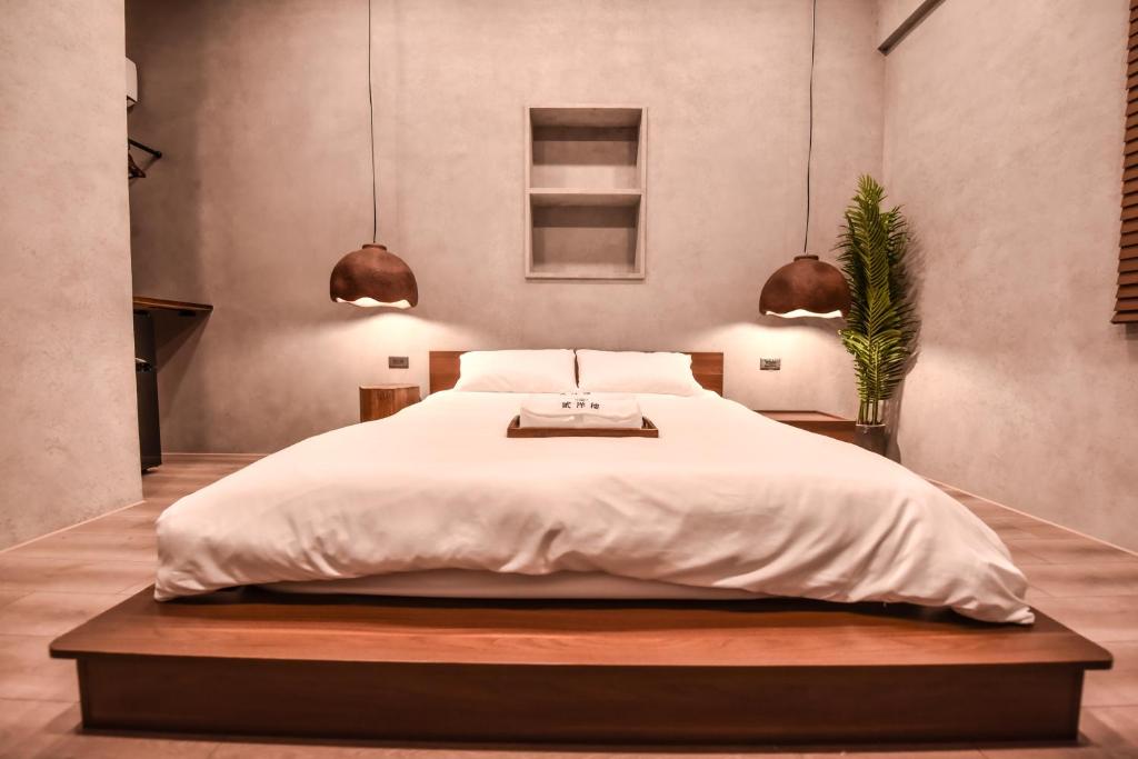 Postel nebo postele na pokoji v ubytování Eryang Homestay