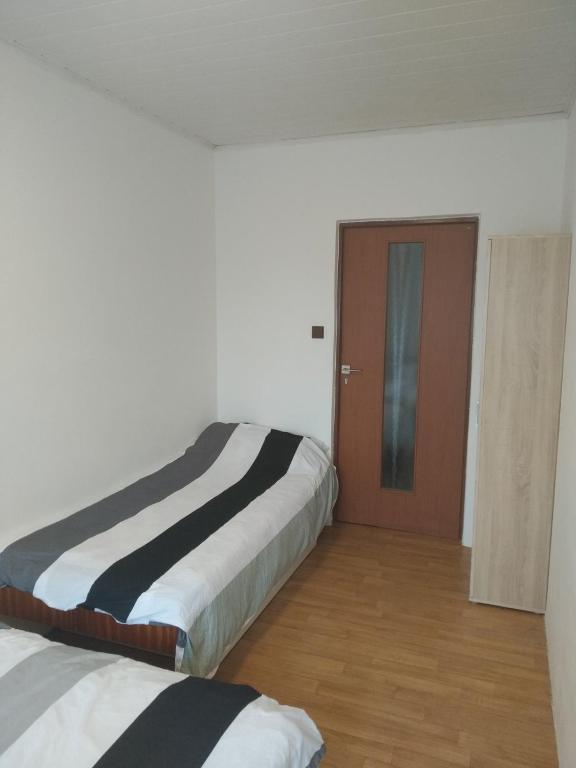 Postel nebo postele na pokoji v ubytování Chalupa V Meruňkovém Sadu