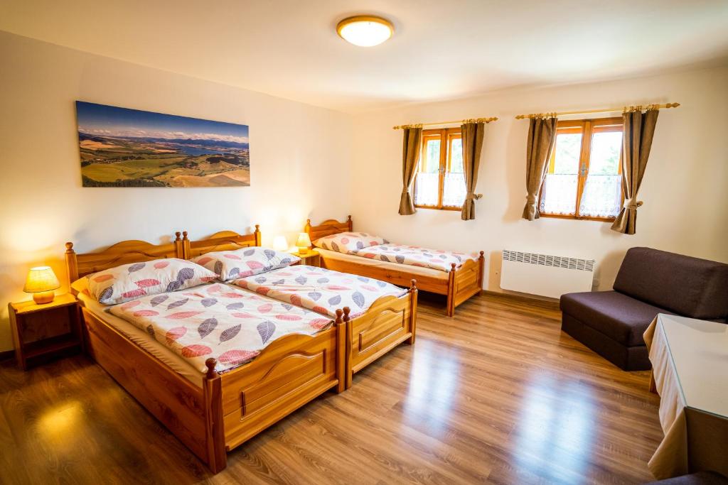 Postel nebo postele na pokoji v ubytování Chata Mária & Apartmány Mária