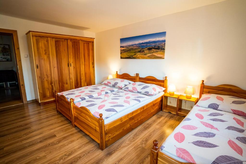 Postel nebo postele na pokoji v ubytování Chata Mária & Apartmány Mária