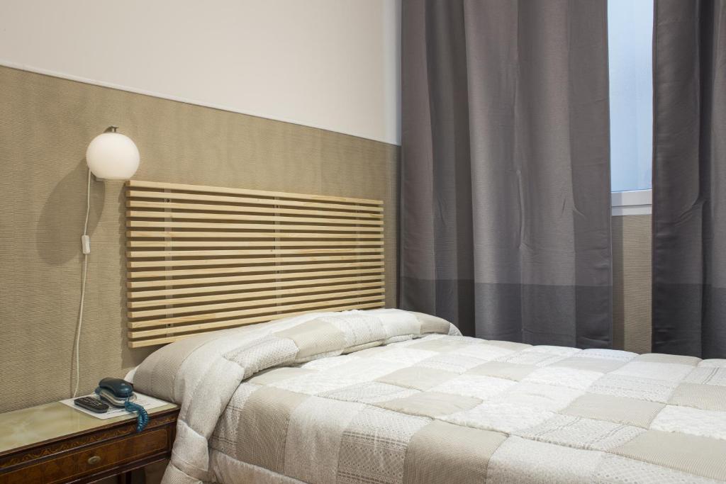 Llit o llits en una habitació de Loggia Fiorentina