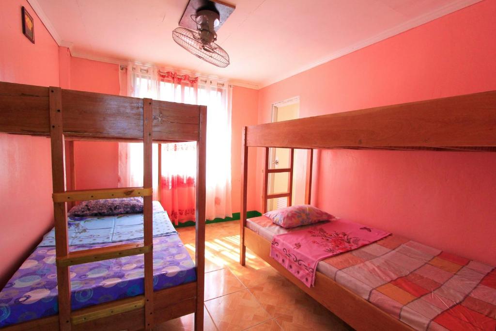Postel nebo postele na pokoji v ubytování Joval Homestay