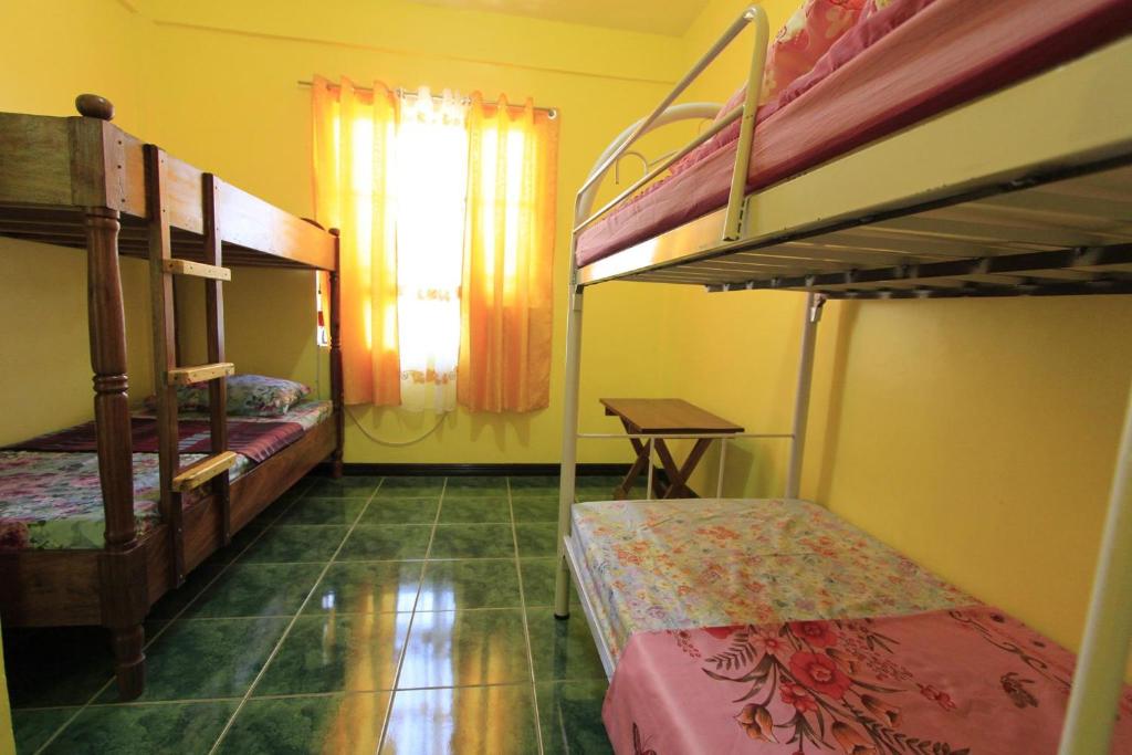 Postel nebo postele na pokoji v ubytování Joval Homestay
