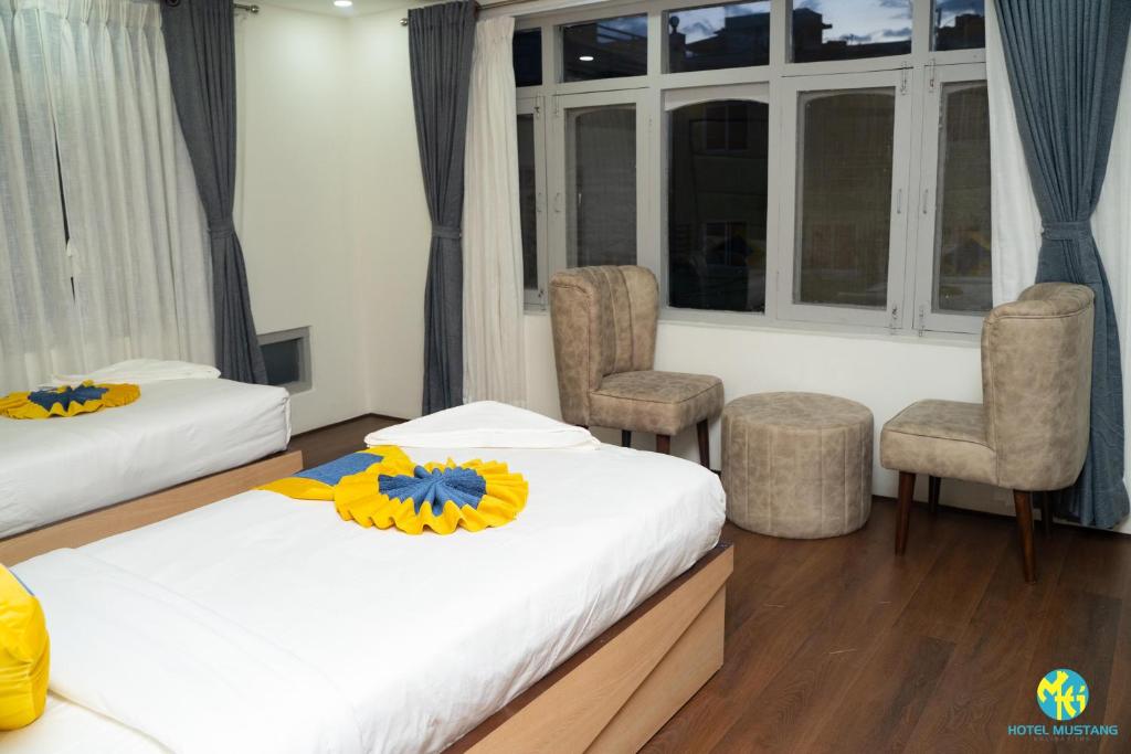 Postel nebo postele na pokoji v ubytování Hotel Mustang Holiday Inn